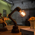liquidluxe-kreative-eisenTischlampe-industrial-waterpipe-design-e27-fassung-schwarz-bronze-xlumina