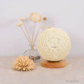 Wovenglow - Rattan Kugel Tischlampe